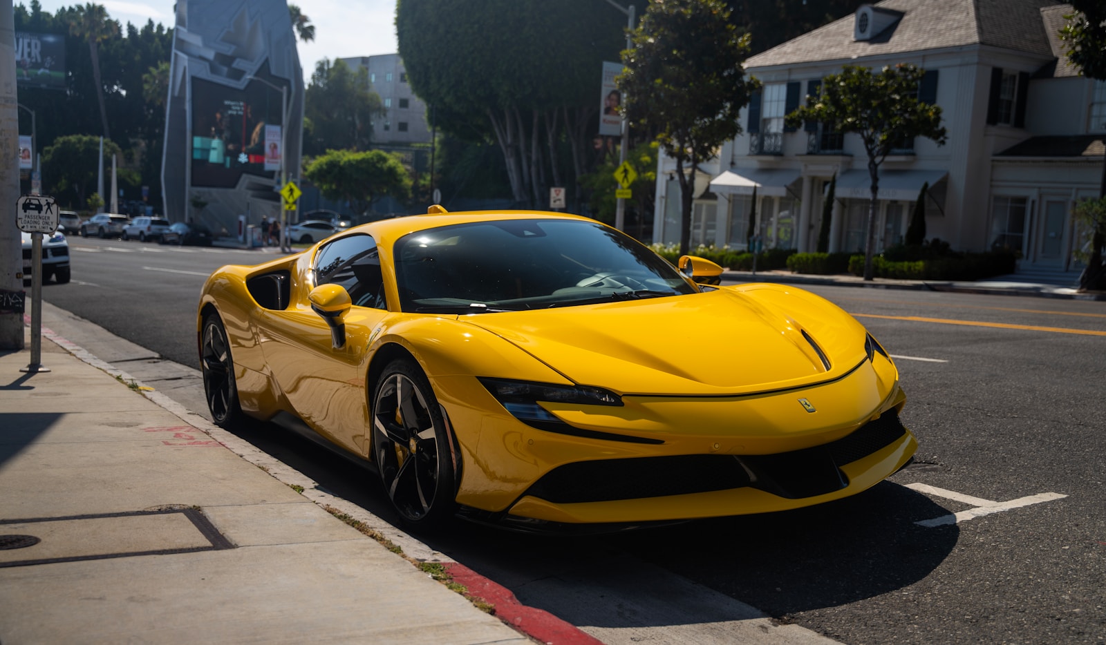 A yellow sports car parked on the side of the road